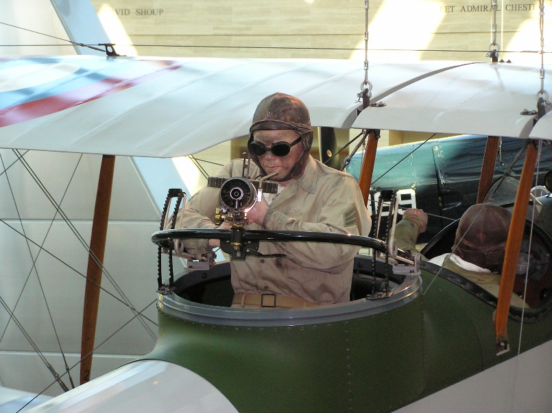 Marine in plane aiming machine gun