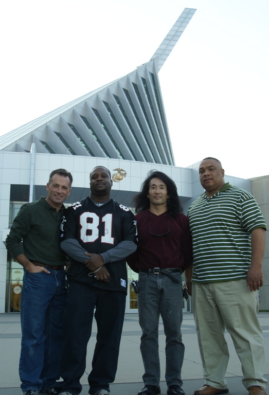 Group pic in front of the flag raising section of the museum building