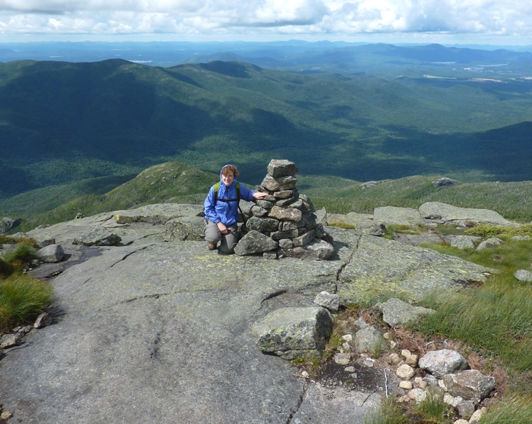 Norma next to cairn comprised of large rocks