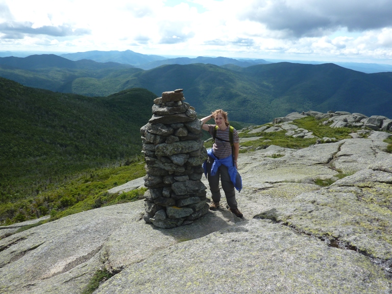 Norma next to large cairn