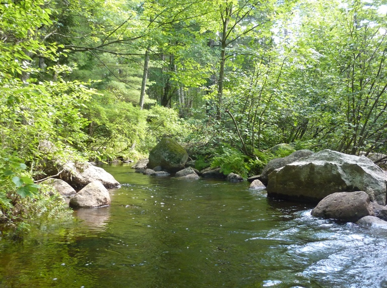 Narrow waterway between boulders