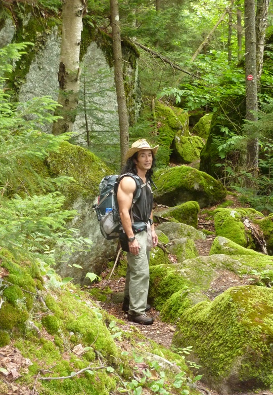 Me surrounded by mossy boulders