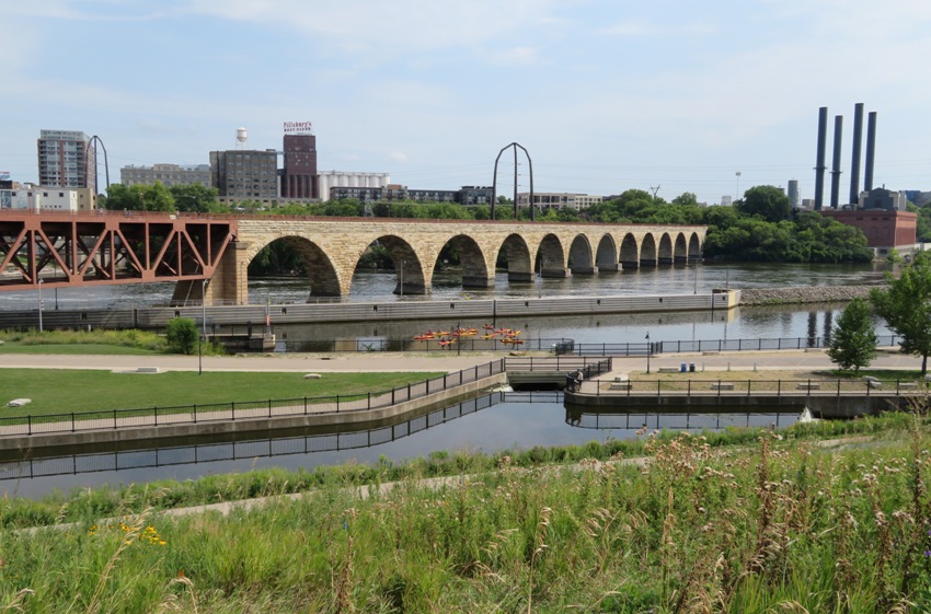 Bridge, lock, and city skyline