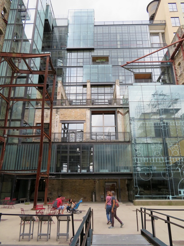 Norma and Carmen in front of glass side of building