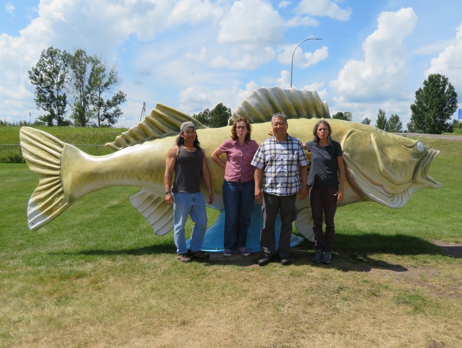 The four of us in front of the fish statue