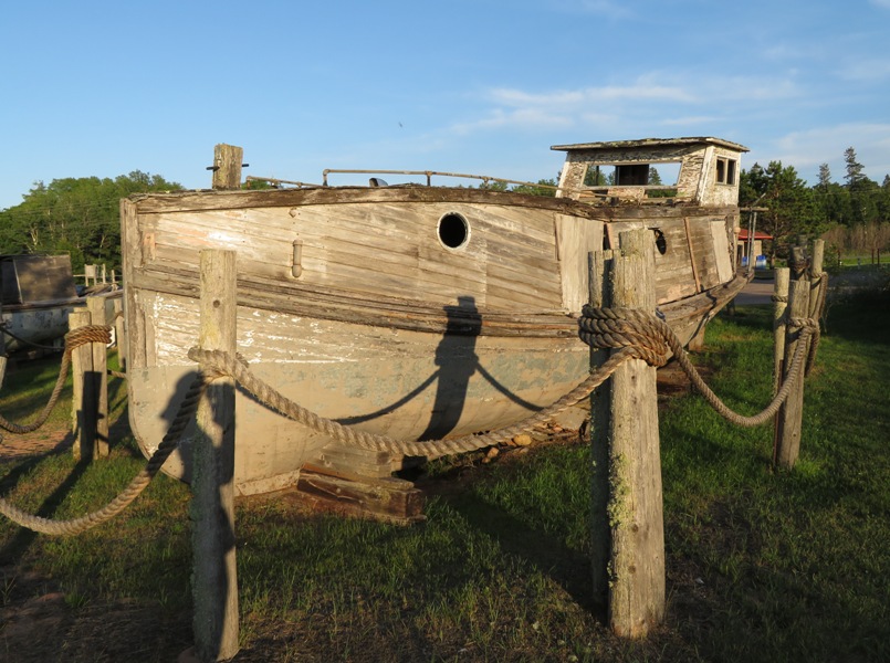 Old wooden boat with round portholes