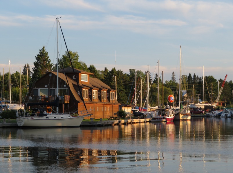 Marina with lots of boats and '76' gas station sign