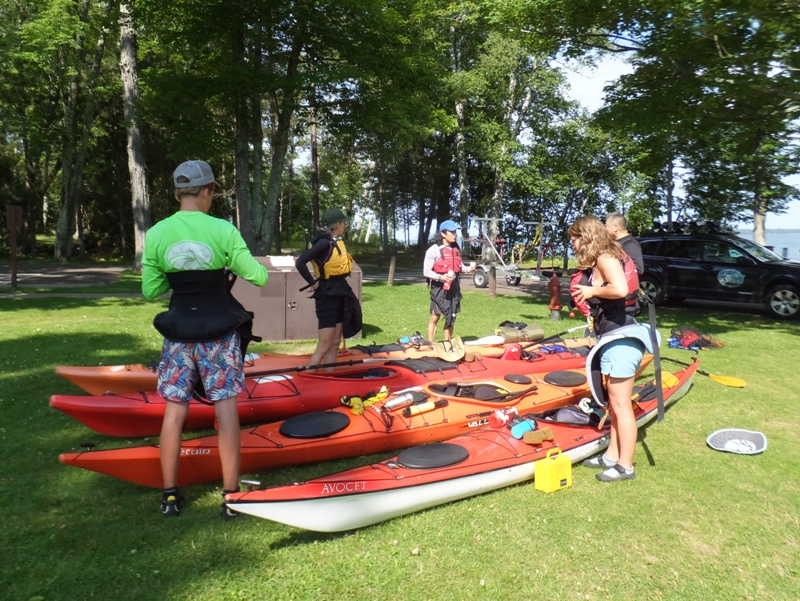 Our group loading gear in kayaks