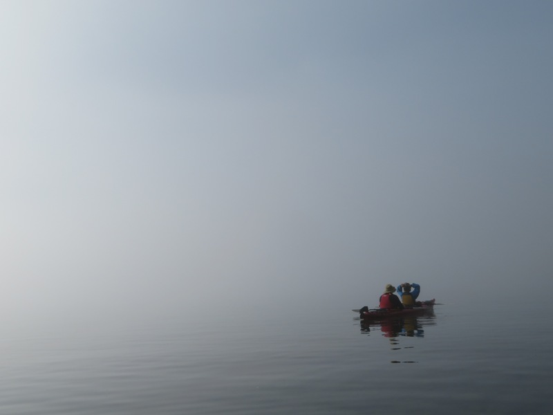 Steve and Carmen in their kayak in a thick fog