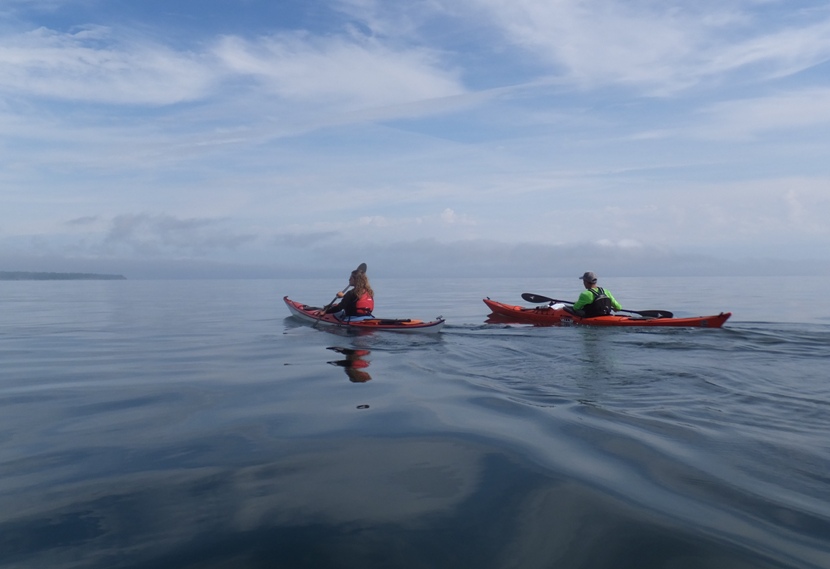 Two kayaks on very smooth water