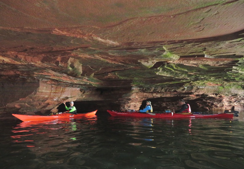 Kiah, Carmen, and Steve in a sea cave