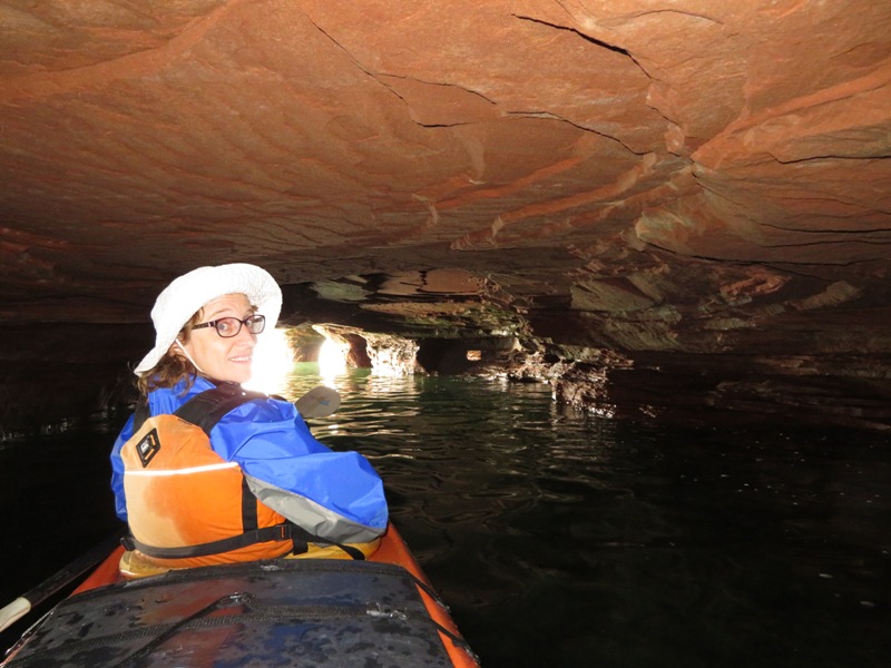 Norma in a sea cave with an illuminated ceiling