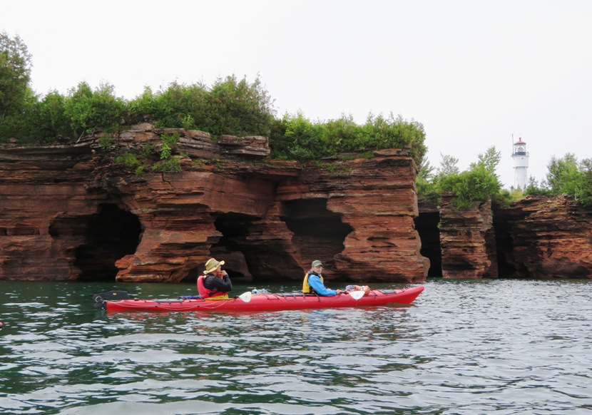 Steve and Carmen in kayak with lighthouse on the right