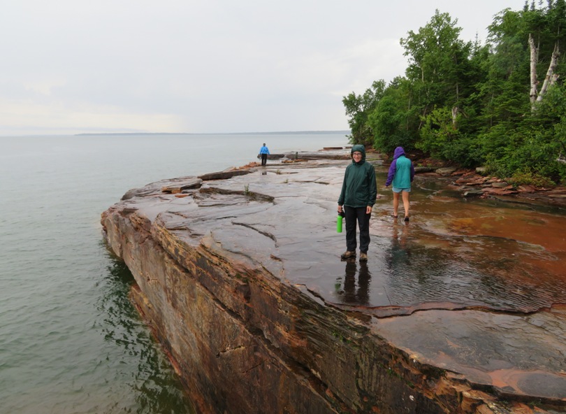 Norma standing at wet, steep ledge