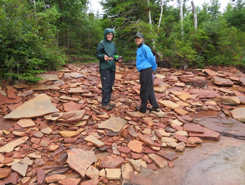 Norma and Carmen standing on flat, sandstone rocks