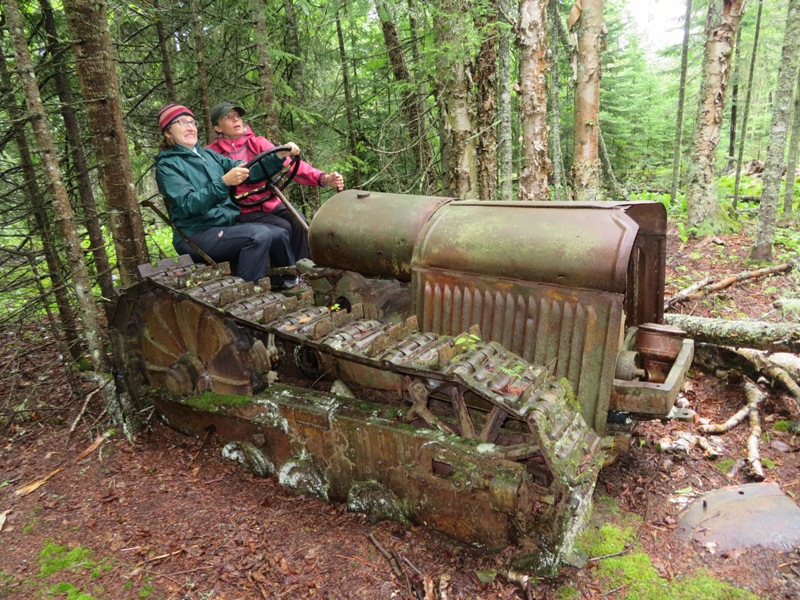 Norma and Carmen looking like they are riding an out-of-control tractor