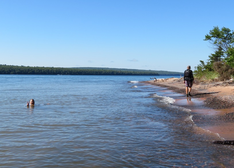 Steve in the water with Kiah on the shore