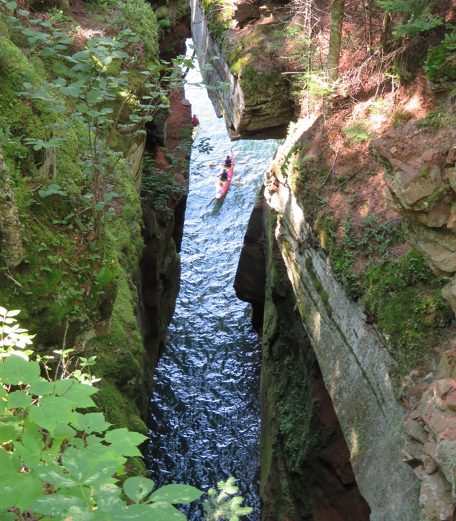 Kayakers in a tandem entering a deep crevasse