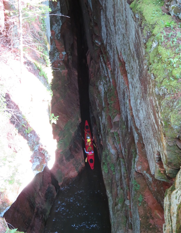 Looking down on kayakers in a very narrow space