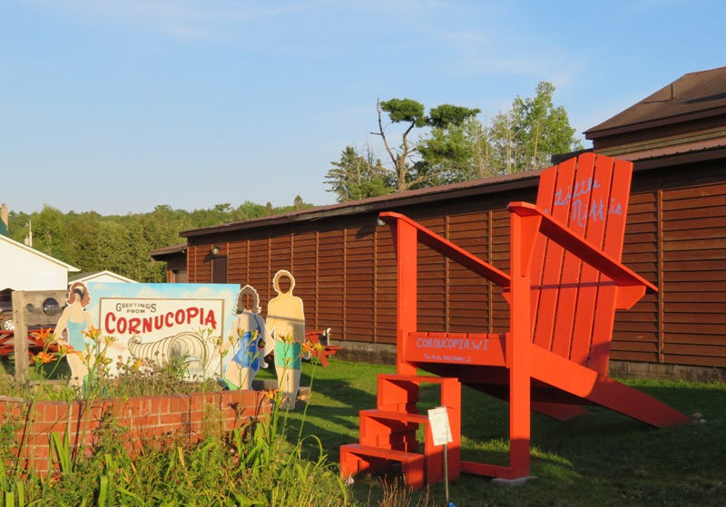 'Cornucopia' town sign and giant red chair at the edge of town