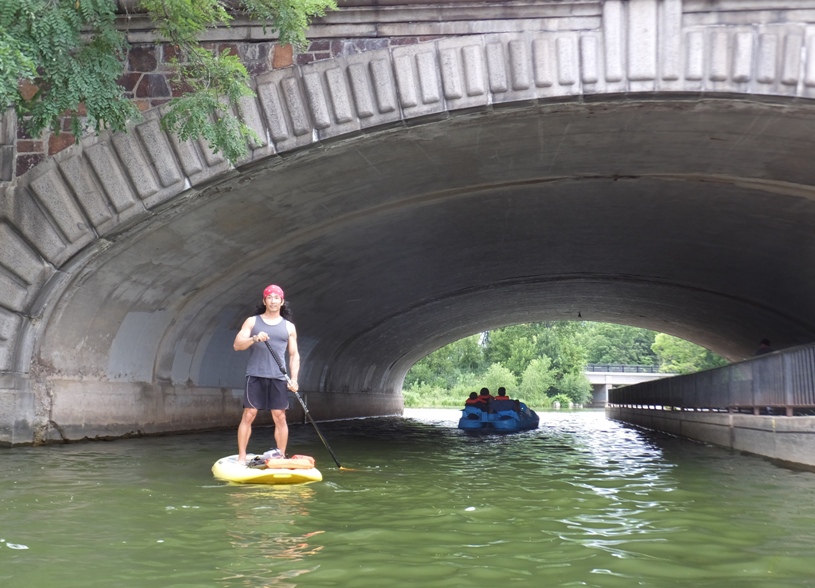 Me on a SUP in front of a bridge