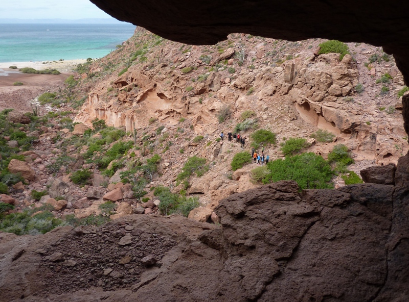 Watching another group hiking from inside a cave