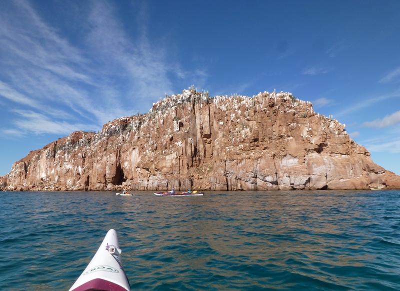 Kayaks in front of island