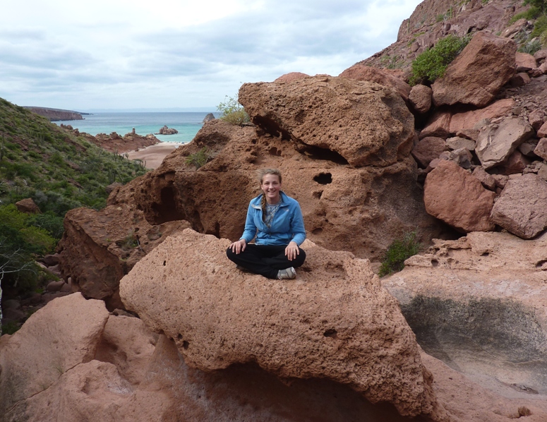 Leah sitting on a big rock