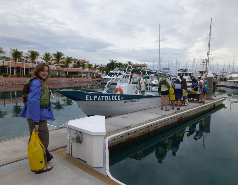 Norma at the dock, holding her dry bag