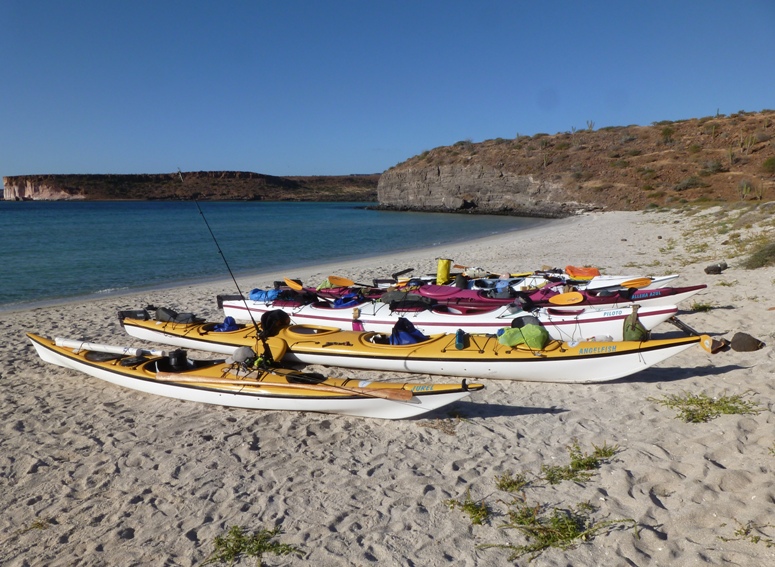 Kayaks on white beach