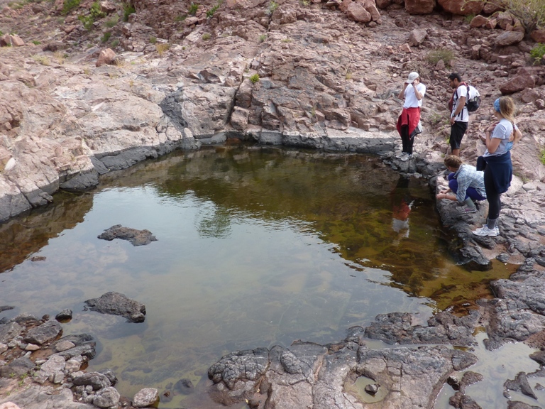 Group around rocky pond