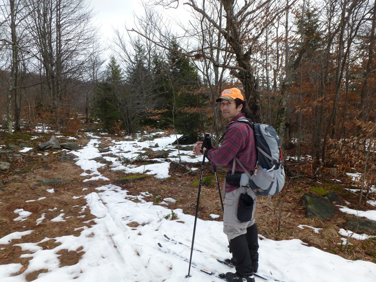 Me wearing skis on trail with little snow