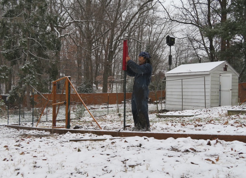 Me using a post driver in the snow