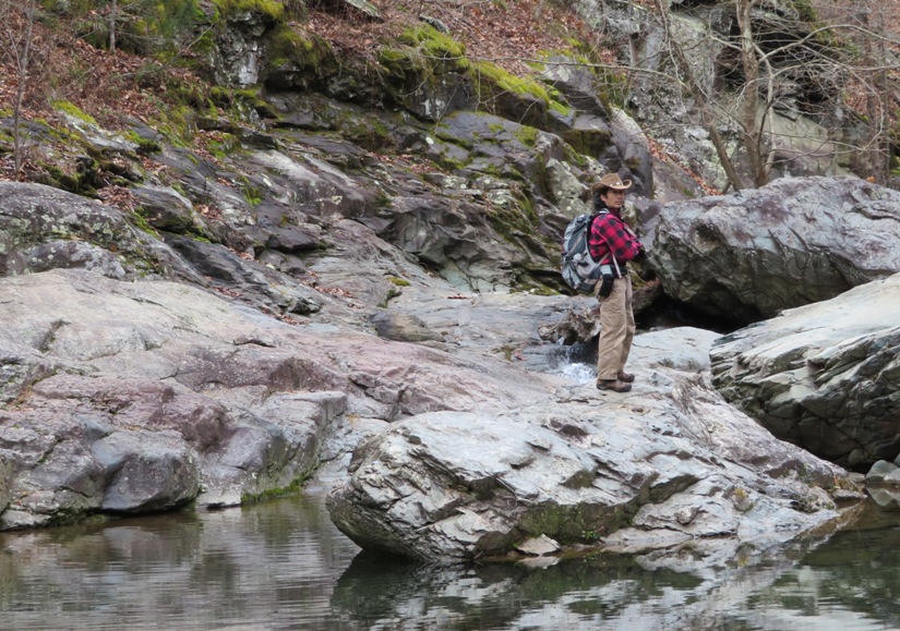 Me standing on rock by deep area of water