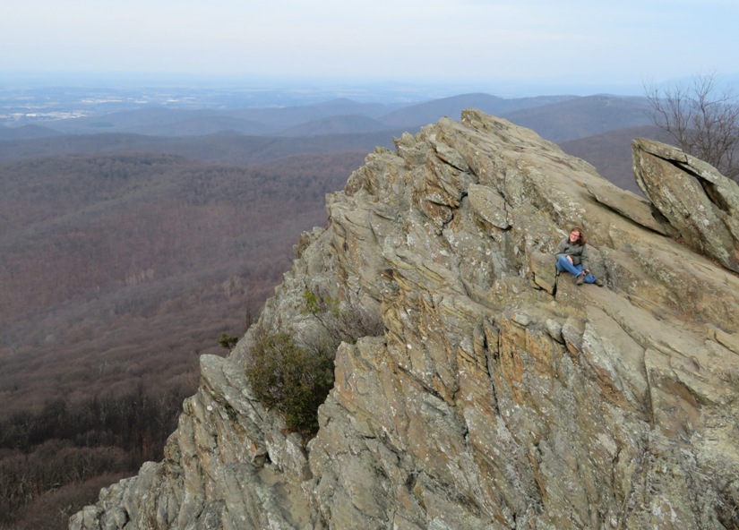 Norma sitting at the edge of Humpback Rocks