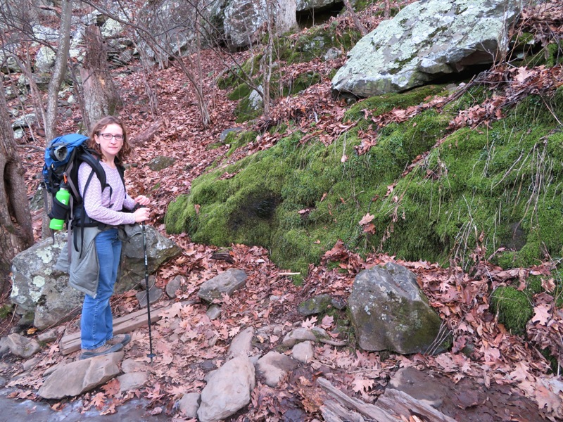 Norma standing next to a patch of moss