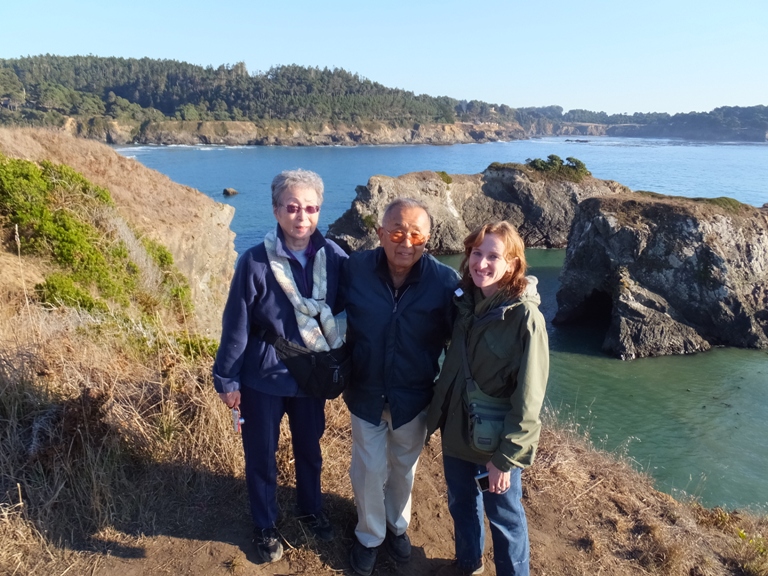 My parents and Norma with two rocky islands behind