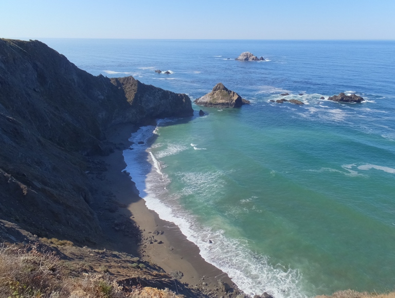 Steep cliffs and green water