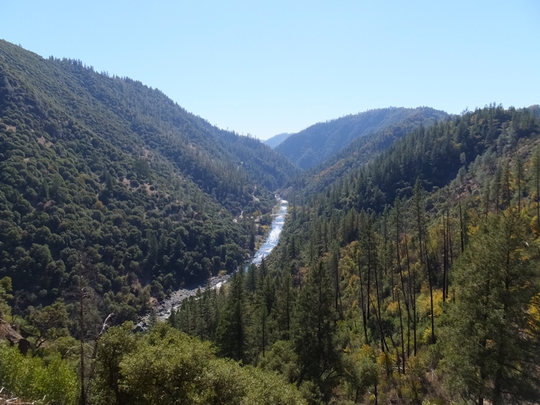 River flowing through green canyon