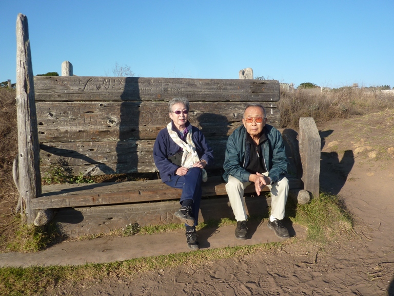 My parents sitting at a bench