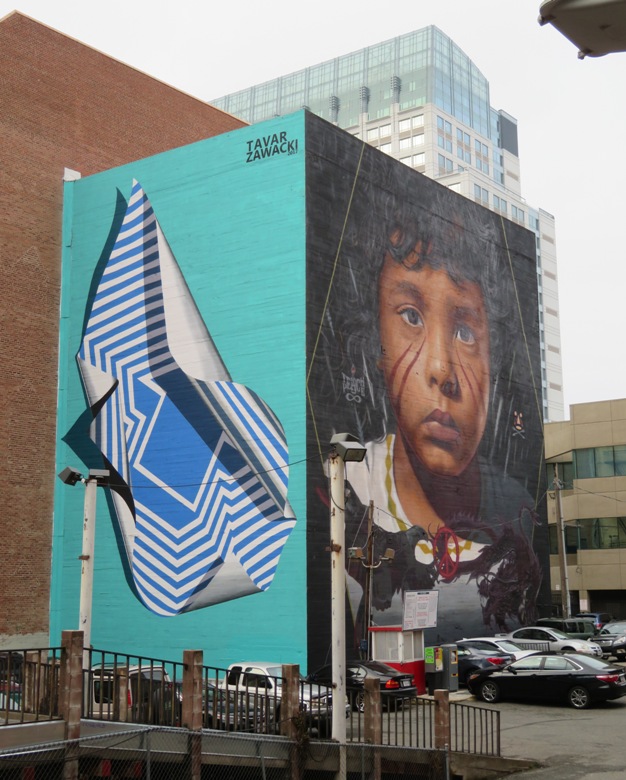 Painting of boy on side of building