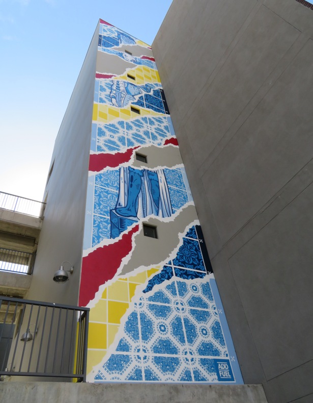 Tall, colorful art tiles on building