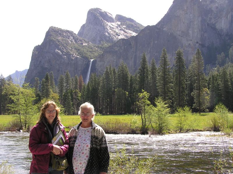 Norma and Hazel with scenic waterfall and rocky view behind