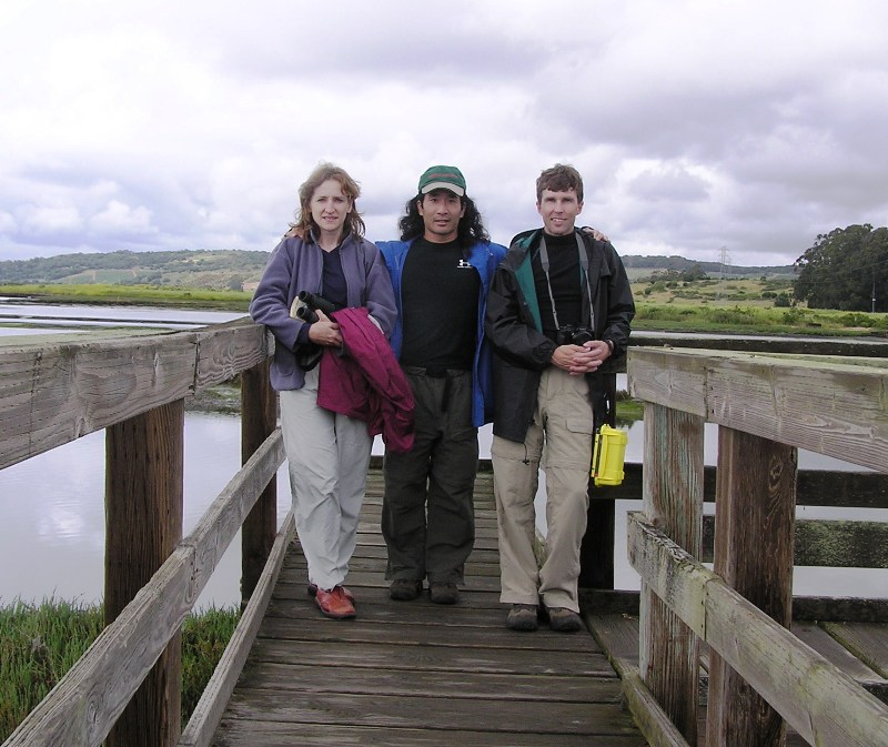 Norma, Ken, and I on the bridge with wetlands behind