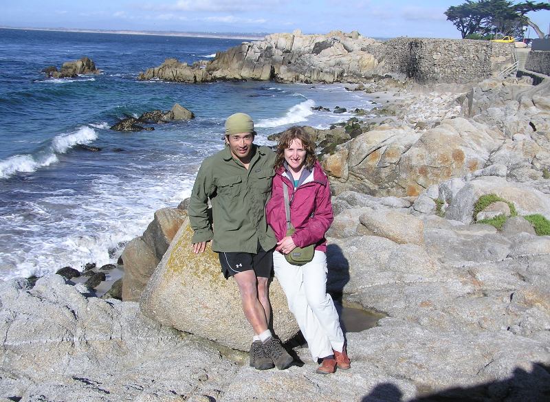 Norma and I on rocks with waves behind