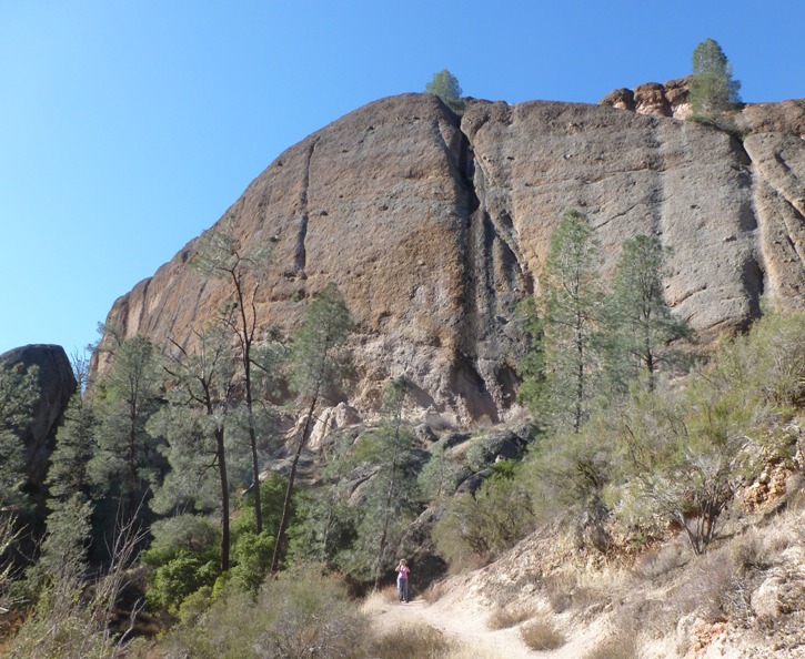 Norma at the base of a vertical rock wall