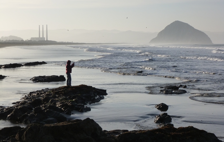 Norma taking a picture with Morro rock in the background