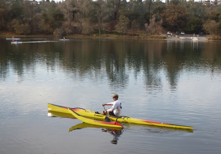 Man on Huki outrigger canoe