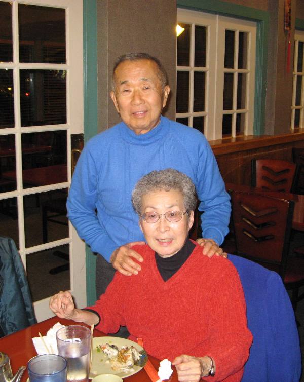 Dad standing, Mom sitting