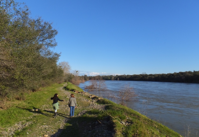 Jodi and Norma walking by high river